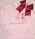 Pink ballerina sweatshirt personalized with the name Harper, pictured with a glittery bow.